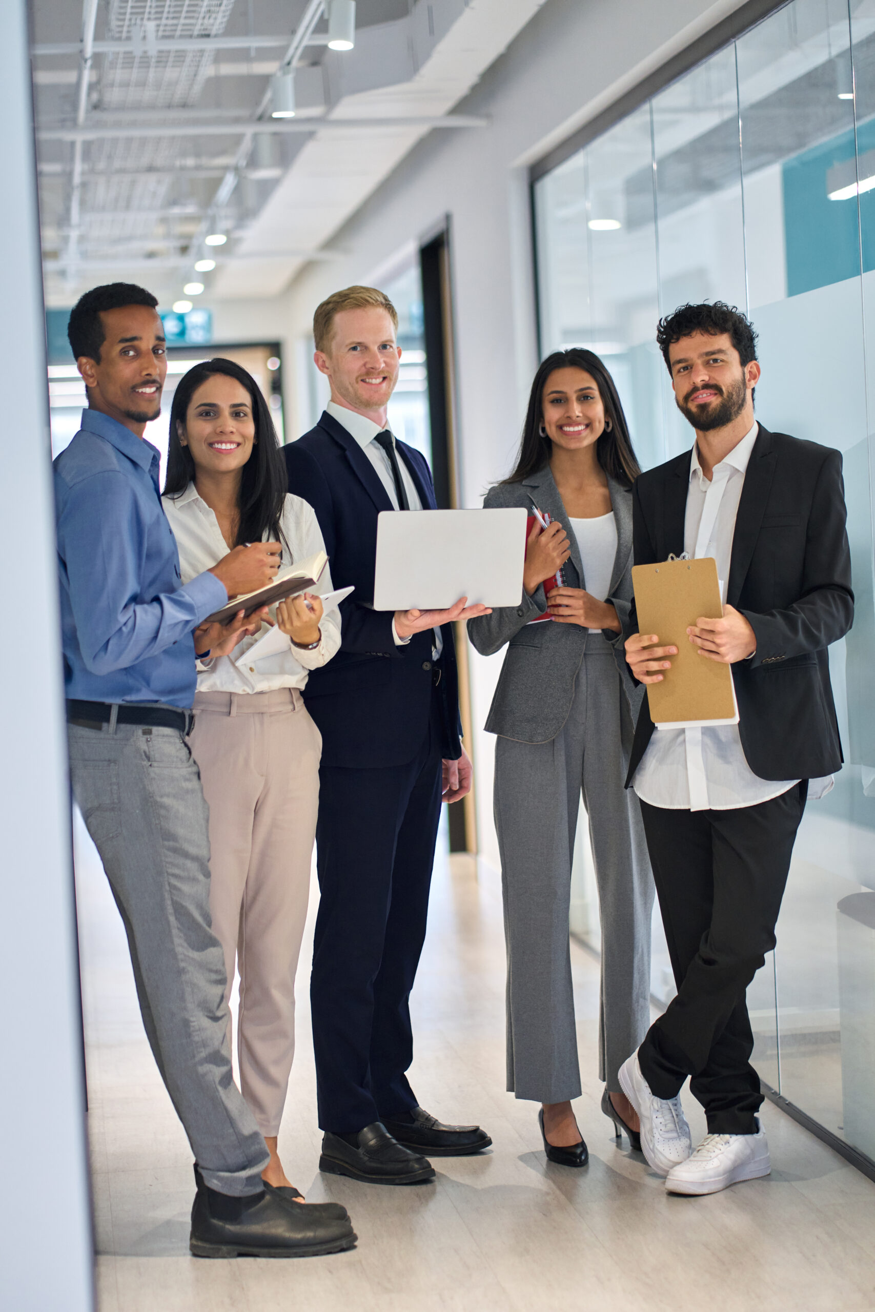 Happy professional team diverse business people in office. Vertical portrait.